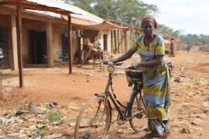 A Nigerian Woman With A Bicycle
