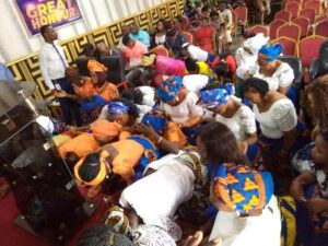 Women of Solemn Faith International Church Port-harcourt, With Their Faces Bowed Receiving Special Prayer 